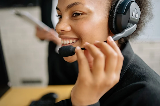 Woman with headset smiling